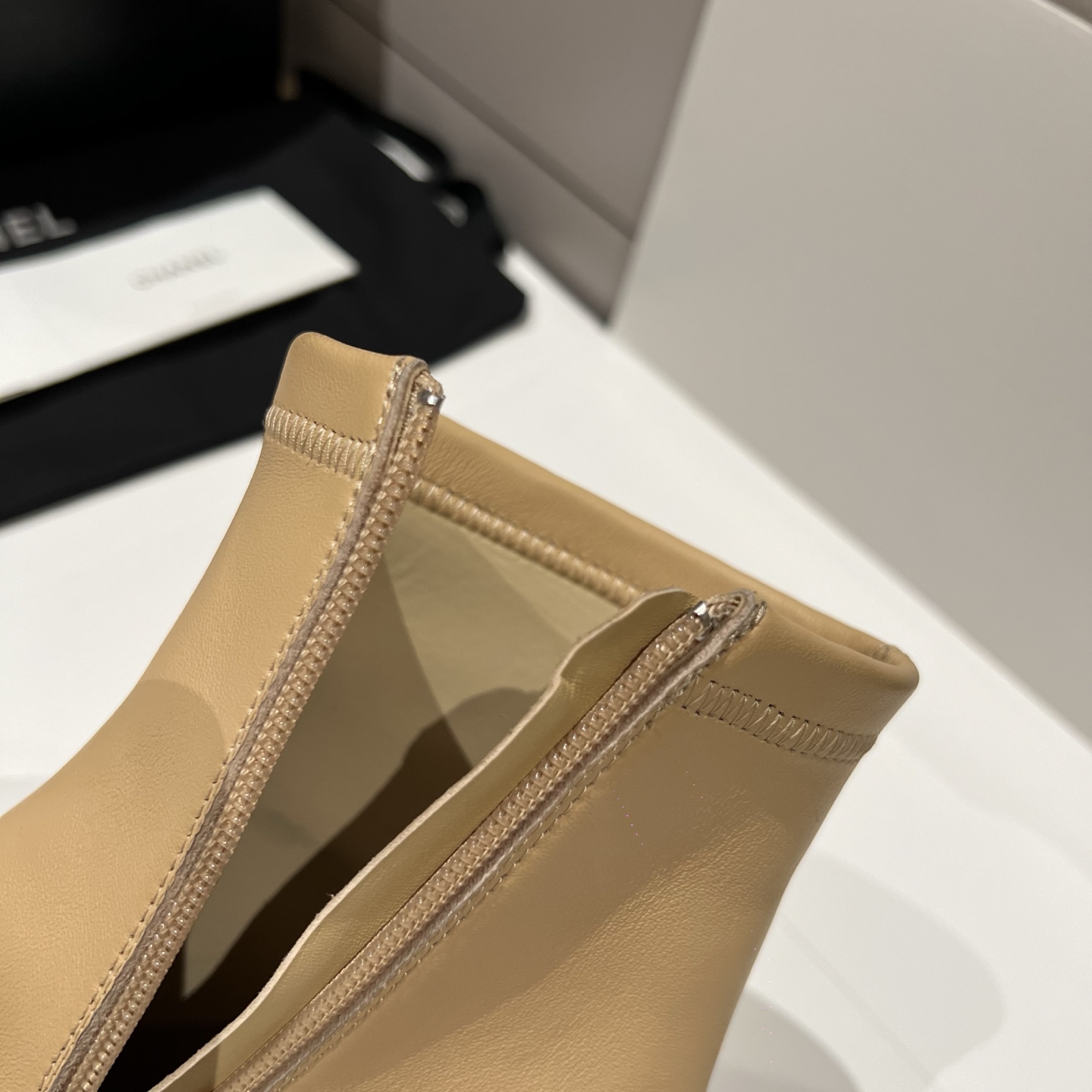 Bagsaaa Ch**el beige and black leather cap-toe ankle boots with zipper