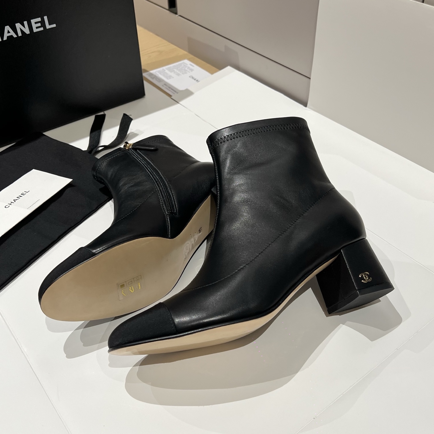 Bagsaaa Ch**el black leather cap-toe ankle boots with zipper