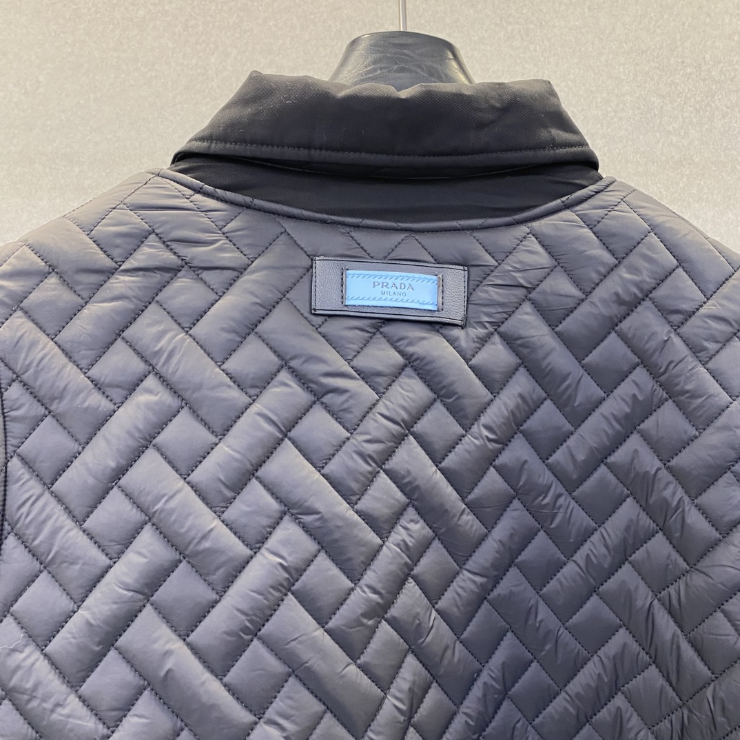 Bagsaaa black Pra*a Re-Nylon jacket with a quilted vest overlay