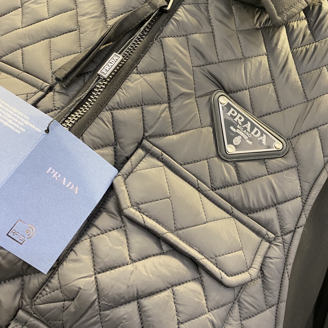 Bagsaaa black Pra*a Re-Nylon jacket with a quilted vest overlay