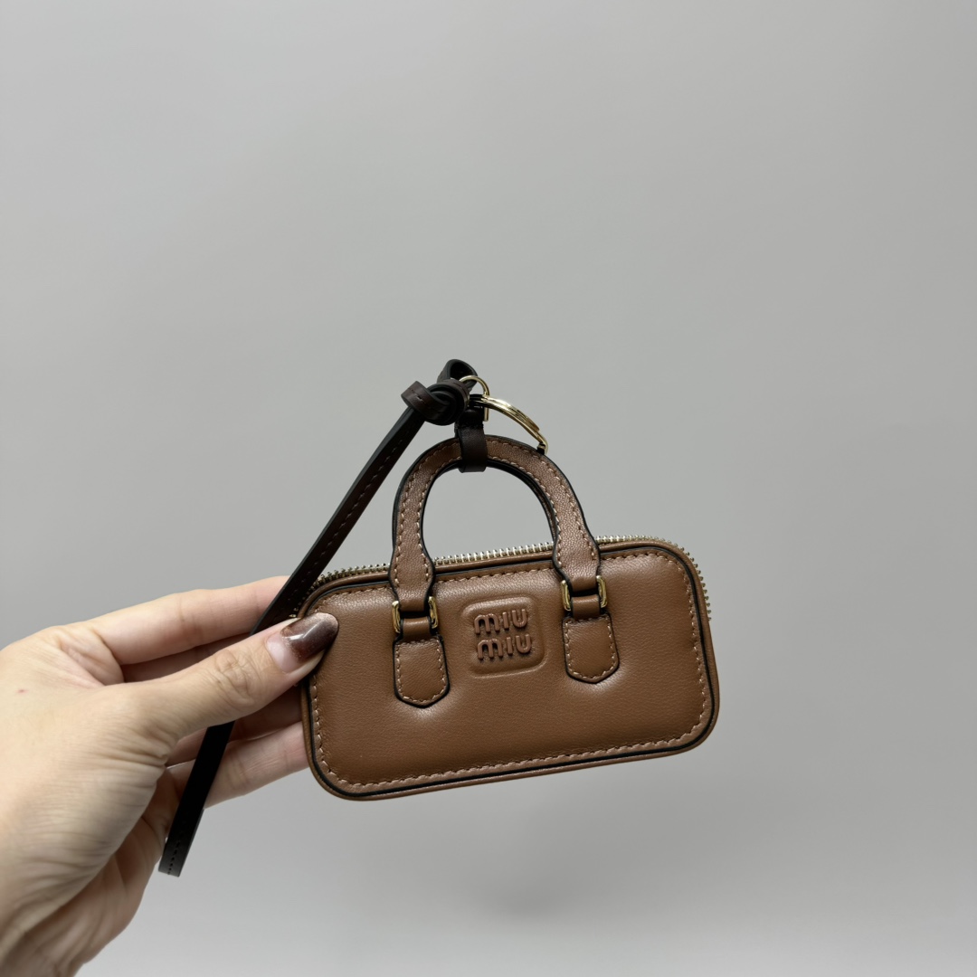 Bagsaaa Miu Miu Trick Arcadie leather keychain charm in a brown