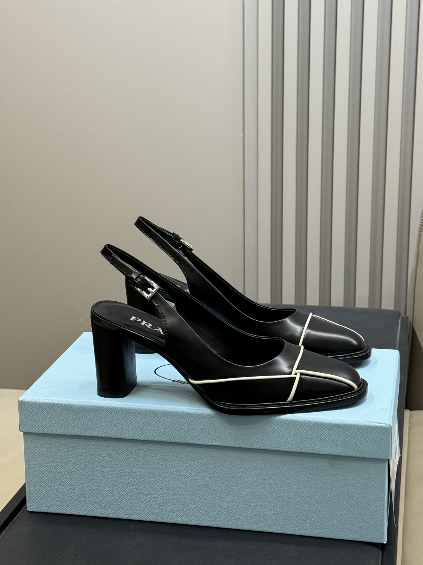 Bagsaaa Pra*a black leather slingback pumps with white piping