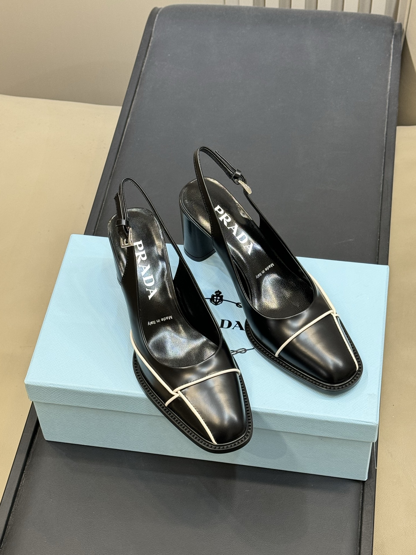 Bagsaaa Pra*a black leather slingback pumps with white piping