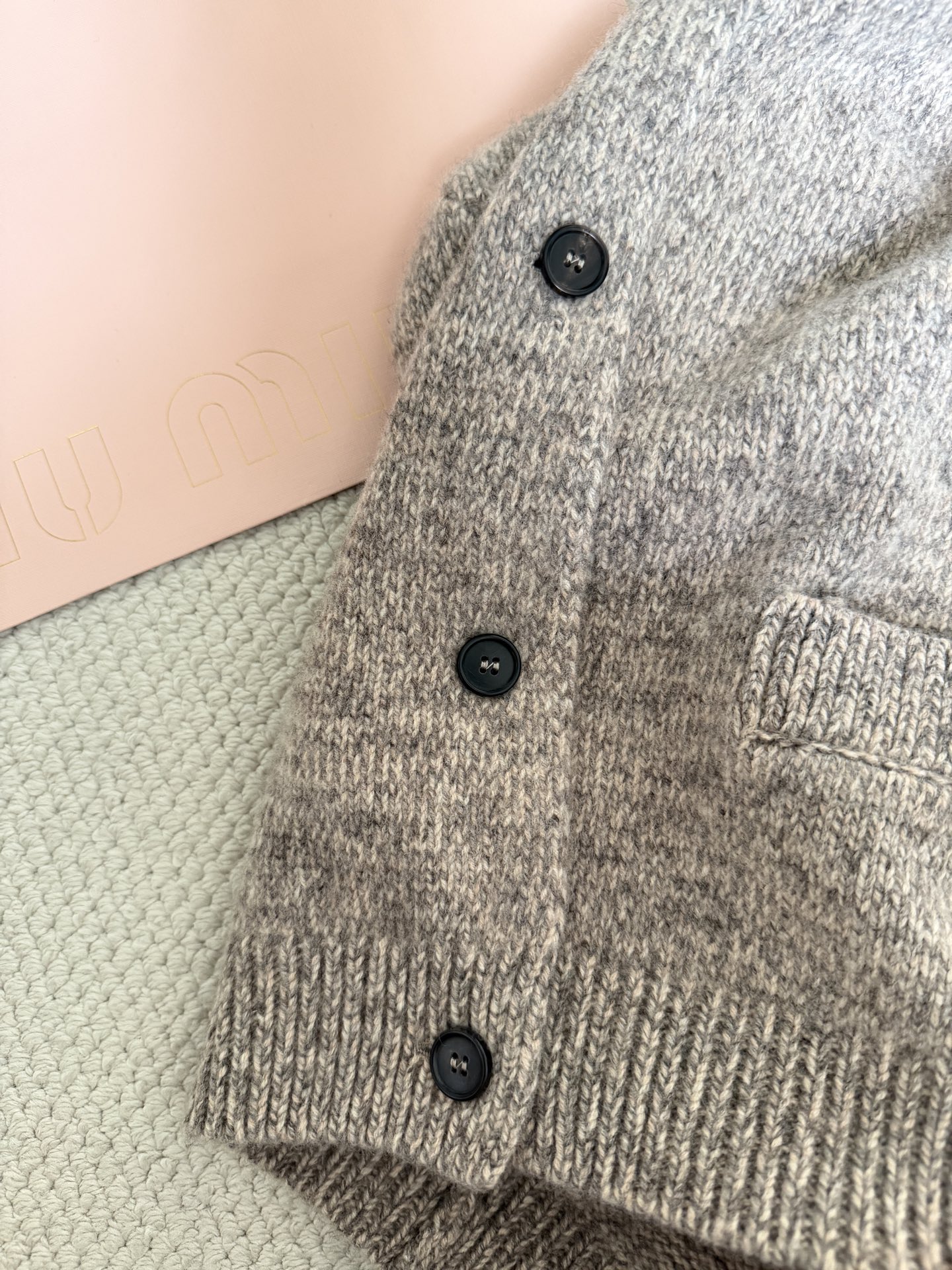 Bagsaaa Miu Miu wool cardigan with a crew neck and pockets